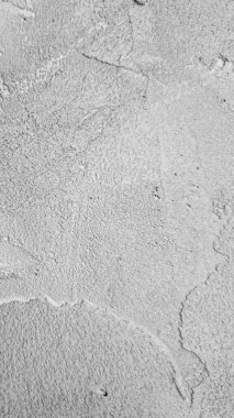 Doğal dokusu olan gri beton yüzey deseni. İnşaat temaları, minimalist tasarımlar ve sanatsal projeler için harika..