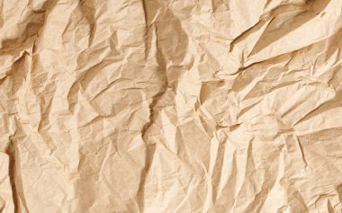 Kahverengi desenli kraft kağıt, geri dönüşümlü kart. Eski buruşmuş geri dönüştürülmüş kağıt, yakın plan, geri dönüştürülmüş kağıt.