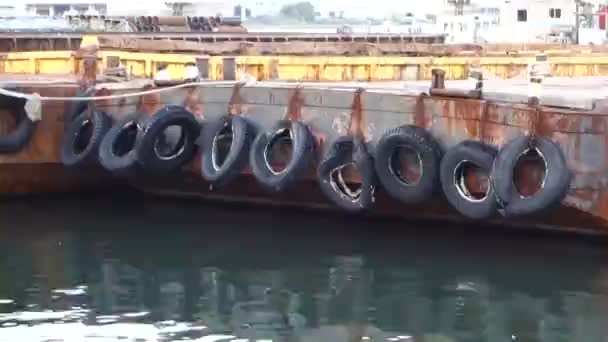 Harbor Dusk Pattern Old Tires Cushioning Moored Cargo Ships — Stockvideo