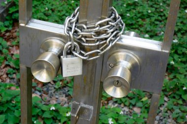 Heavy duty metal chain lock attached to gate door