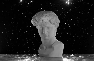 Statue of the head of David on a black background