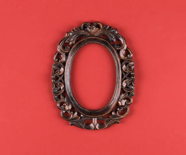 artistic picture oval frame isolated on red background