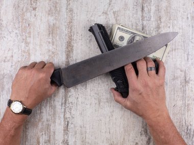 hands with knife and gun