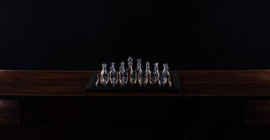 chess board with chess pieces, black studio background