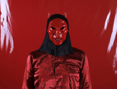 men in japanese devil mask