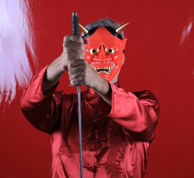 men in japanese devil mask