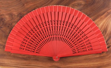 paper chinese fan on wooden background