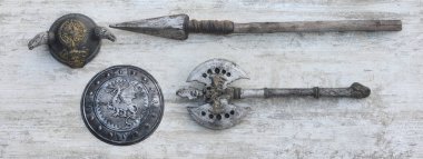 viking weapon on white wooden background