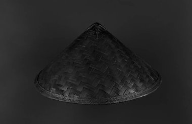 black chinese hat cone isolated on black background
