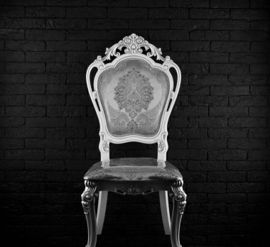 vintage white rich chair on black background