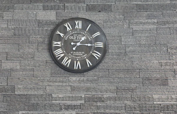 vintage wall clock for interior decoration on old wall