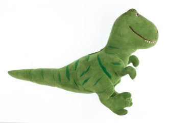 yeşil pelüş dinozor beyaz arkaplanda izole edilmiş