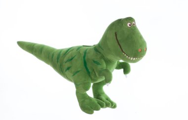 yeşil pelüş dinozor beyaz arkaplanda izole edilmiş
