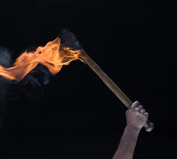 A man holding a fire torch and burning a big piece of oak creating flames  and smoke, old jappanese shou sugi ban technique. black wooden material.  Gra Stock Photo - Alamy