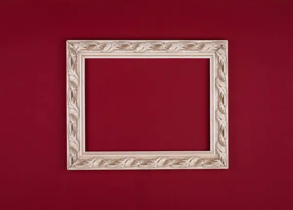white carved frame isolated on red background