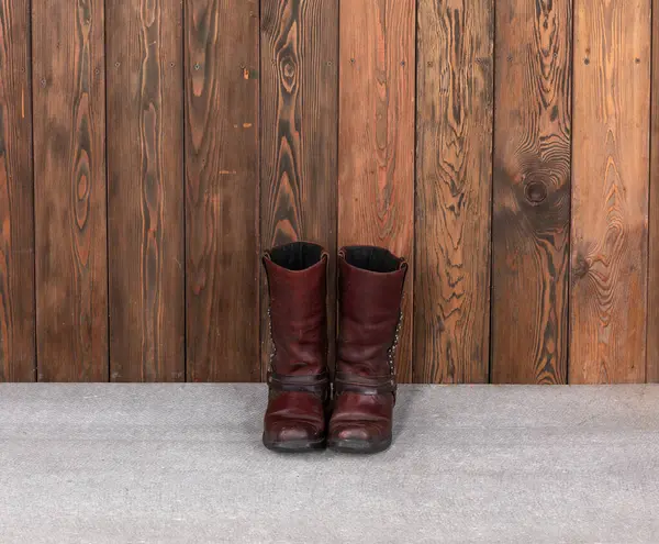 cowboy boots on wooden floor