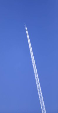 double track in the sky from a jet plane