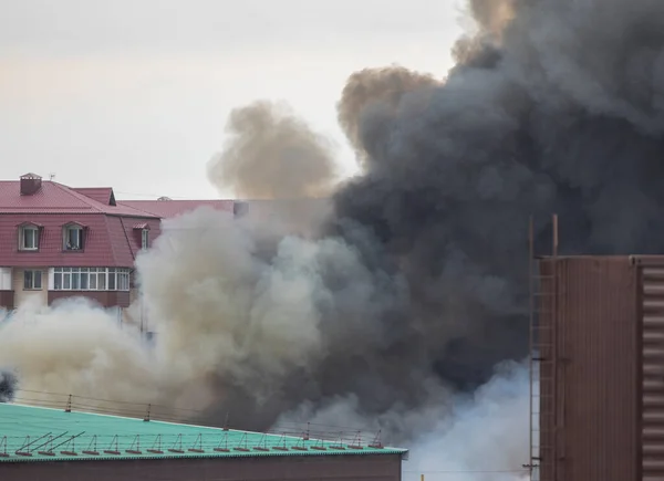 burning buildings and a warehouse, smoke and fire in the city