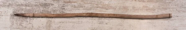 ancient shepherd staff on wooden background