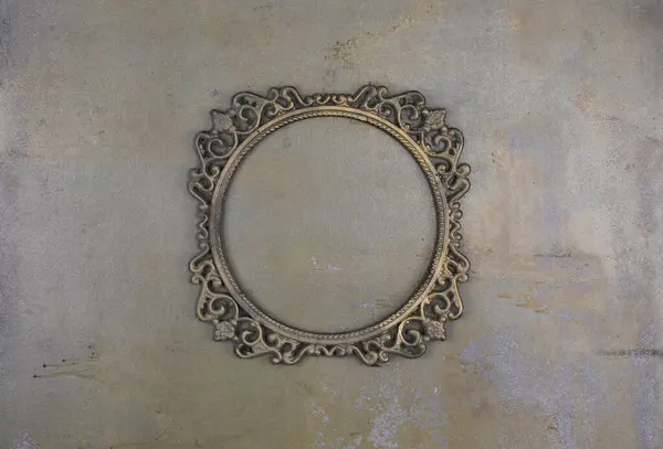 stock image golden ancient dusty frame on a concrete wall