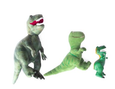 Beyaz arka planda izole edilmiş yeşil dinozor oyuncakları