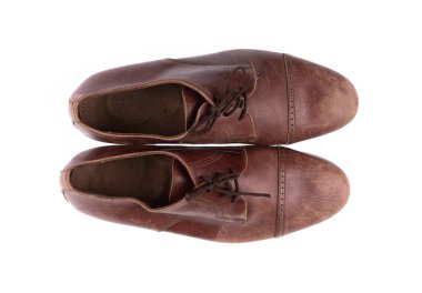 old brown worn leather men's shoes isolated on white background
