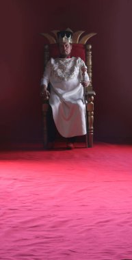 king in white robe on throne