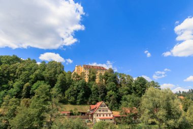 Untergrningen Castle in the Swabian Alb on a sunny day with blue sky.