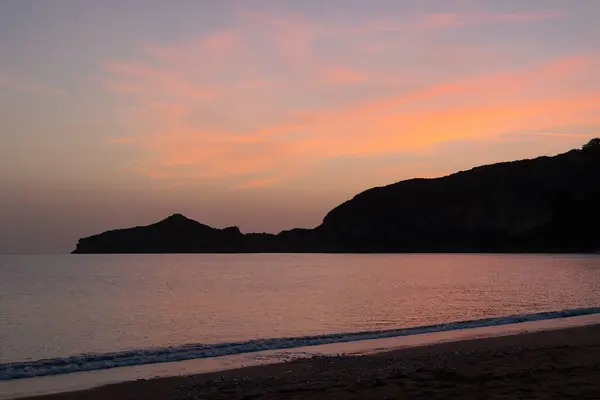 stock image Sunset over the sea and the bay of Agios Georgios on the island of Corfu