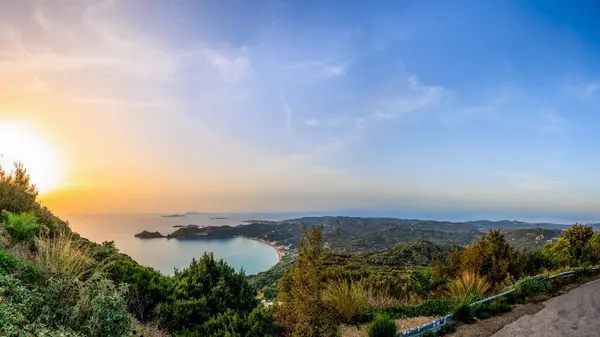 stock image Sunset over the sea and the bay of Agios Georgios on the island of Corfu