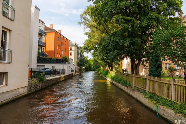 stock image Residential buildings to the left and right of the Senkelbach in Augsburg Oberhausen