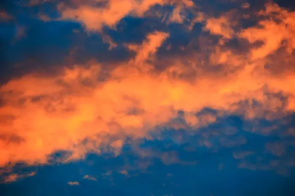 stock image Orange glowing evening clouds in the sky above the Brunnenbach in the forest near Augsburg Siebenbrunn