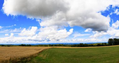 Blue sky with Comulus clouds over valley of river Main in Upper Franconia in Bavaria clipart