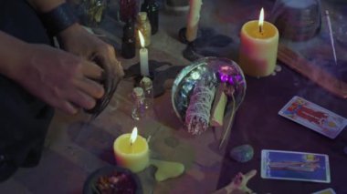 close - up of woman making a candle at home