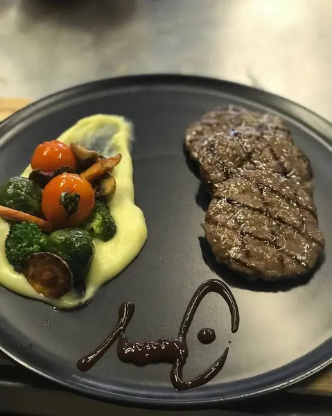beef steak with sauce and vegetables