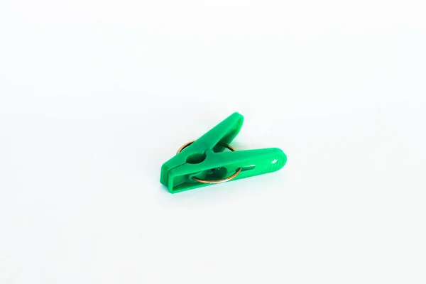 stock image green clothespin isolated on white background