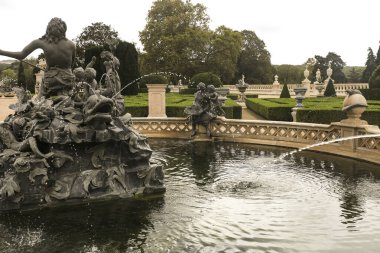 Queluz, Lisbon, Portugal- November 21, 2022: Beautiful and vintage sculptures of the fountain of the garden of Queluz Palace