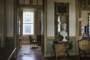 Queluz, Lisbon, Portugal- January 17, 2023: Ceiling art, furniture and wall decoration of the Beautiful National Palace of Queluz, Sintra