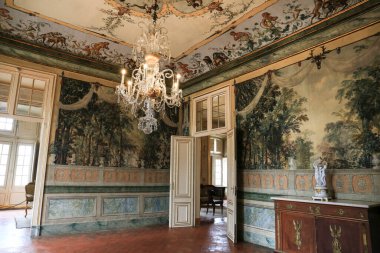 Queluz, Lisbon, Portugal- January 17, 2023: Ceiling art, furniture and wall decoration of the Beautiful National Palace of Queluz, Sintra