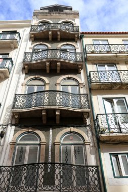 Lisbon, Portugal- November 21, 2022: Colorful and majestic old houses with big windows and tiled facades