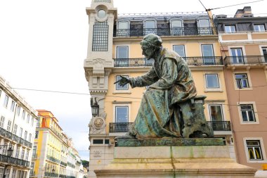 Lisbon, Portugal- October 21, 2022: Bronze sculpture of Antonio Ribeiro writer in Chiado neighborhood in Lisbon