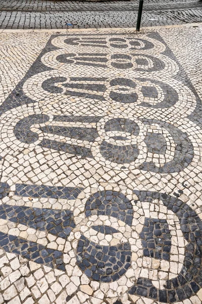 stock image Beautiful Cobblestone pavement of Chiado neighborhood in Lisbon, Portugal