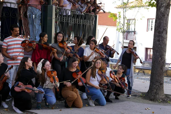 stock image Lisbon, Portugal- October 20, 2022: Group of young people playing the violin in Lisbon