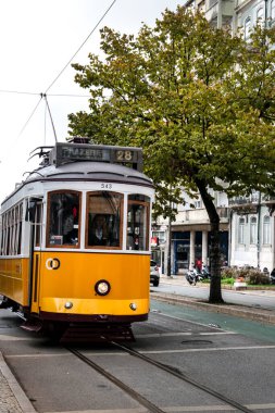 Lisbon, Portugal- November 6, 2022:Vintage tram through the streets in Lisbon