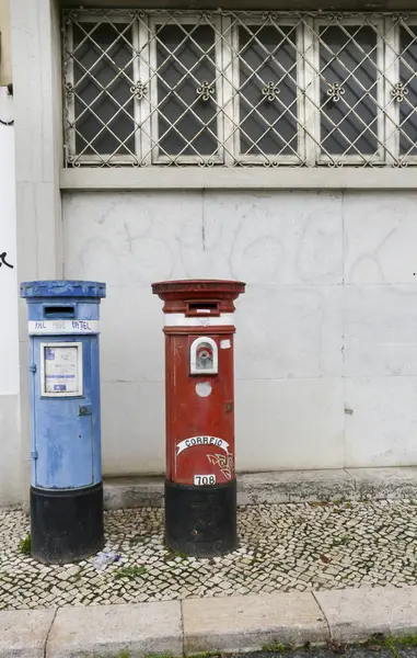 stock image Lisbon, Portugal- October 21, 2022: Vintage red and blue mail post boxes on the street in Lisbon