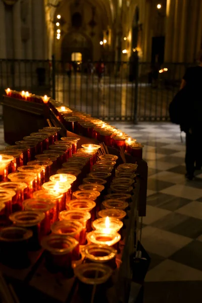 Row of offering candles in a church in Spain