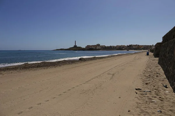 stock image Levante Beach in Cabo de Palos fishing village. Lighthouse in the background