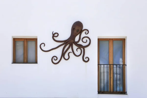 stock image Javea, Alicante, Spain- May 16, 2023: Decorative octopus on the facade of a restaurant in Javea town