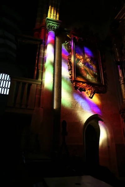 stock image Evora, Portugal- October 10, 2023: Colorful light of a stained window in the interior of the San Francisco Church