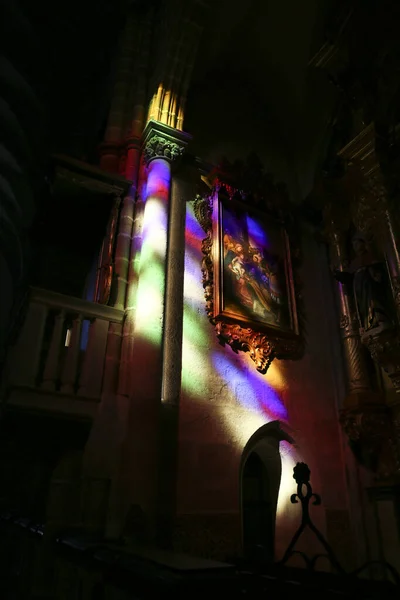 Stock image Evora, Portugal- October 10, 2023: Colorful light of a stained window in the interior of the San Francisco Church